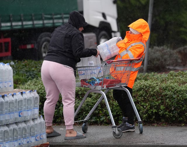 South East Water customers collect bottled water at a water station in East Grinstead