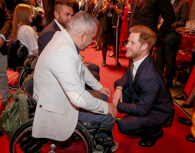The Duke of Sussex speaks with guests during a reception to celebrate the fifth anniversary of the Invictus Games at the Guildhall in central London