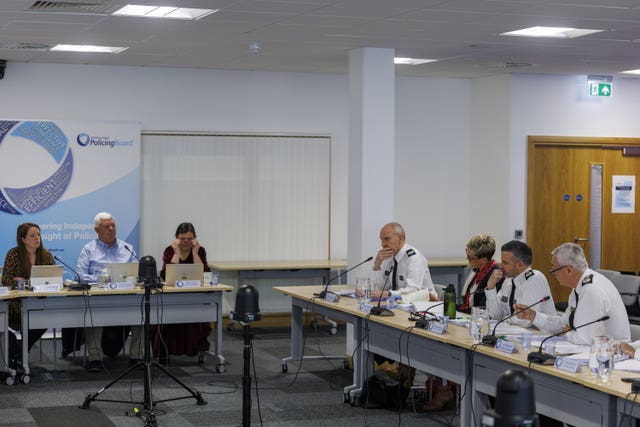 Jon Boutcher, right, replying to a question from Nuala McAllister, left