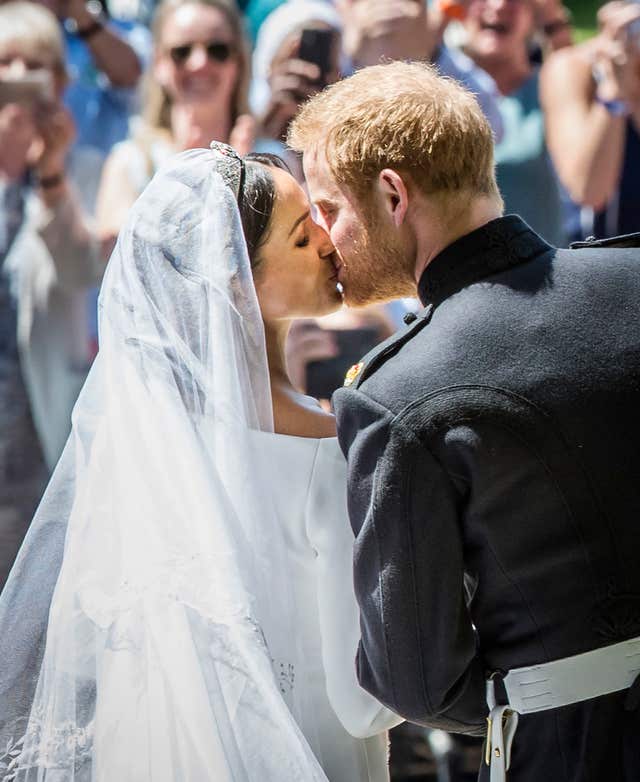 Meghan Markle and Prince Harry kiss