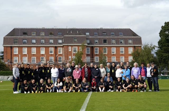 England players and former Lionesses pose for a group photograph during a training session at the Lensbury Resort, Teddington
