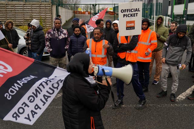 Amazon staff members on a GMB union picket line outside the online retailer’s site in Coventry