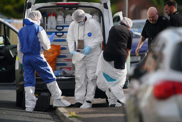 Forensic officers near to the scene in Kingsheath Avenue, Knotty Ash, Liverpool