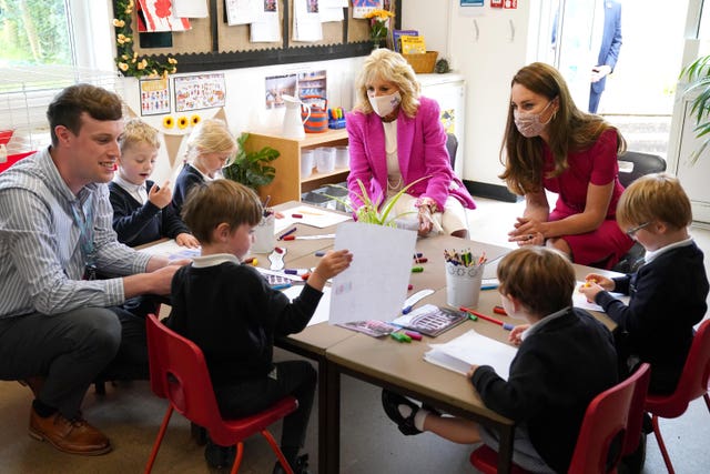 US First Lady Jill Biden (left) and the Duchess of Cambridge talk with children in the school's reception class during a visit to Connor Downs Academy in Hayle, West Cornwall Aaron Chown/PA)
