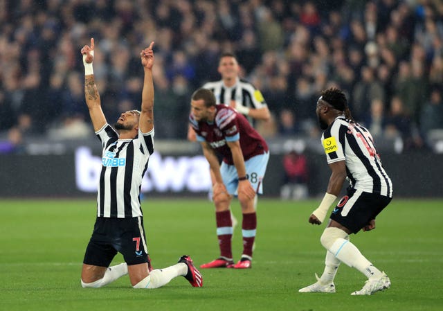 Joelinton, left, celebrates