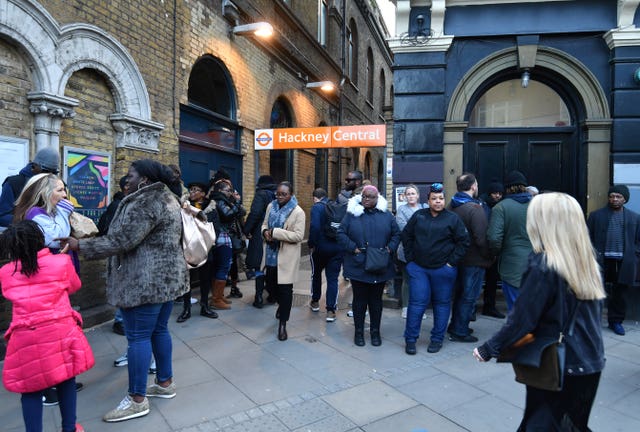 Members of the public take part in a rally by Hackney Central Station (John Stillwell/PA)