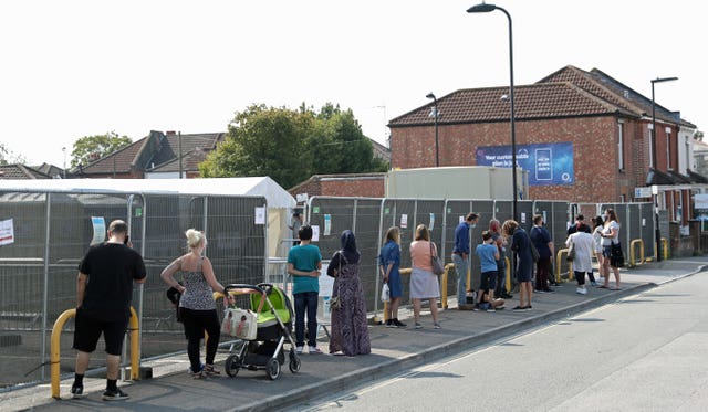 People queue outside a walk-in coronavirus testing centre in Marlborough Road in Southampton (Andrew Matthews/PA)