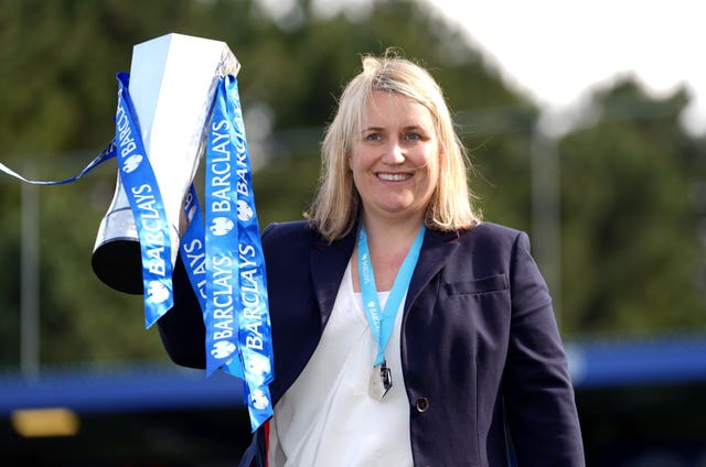 Chelsea manager Emma Hayes celebrates with the Women's Super League trophy
