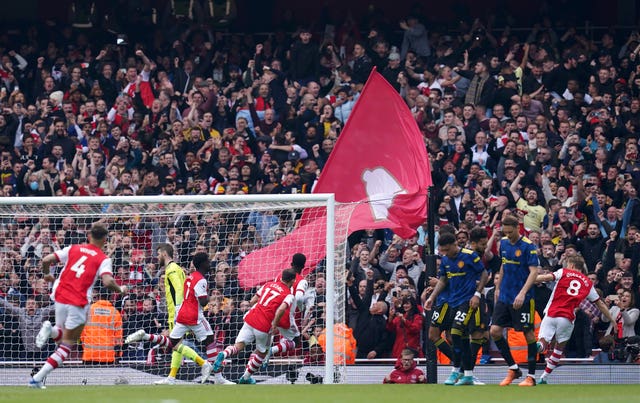 Bukayo Saka celebrates  scoring a penalty against Manchester United 