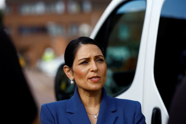 Dame Priti Patel speaks to journalists