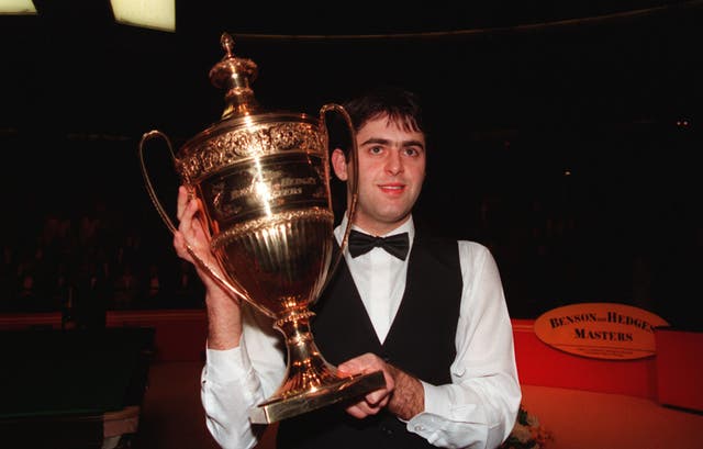 Ronnie O'Sullivan clutches the Benson and Hedges Masters trophy in 1995