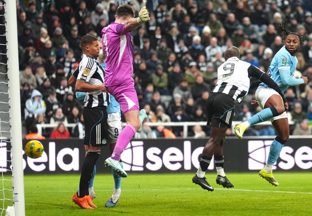 Manchester City’s Antoine Semenyo, right. scores before the goal was ruled out for offside against Erling Haaland, obscured