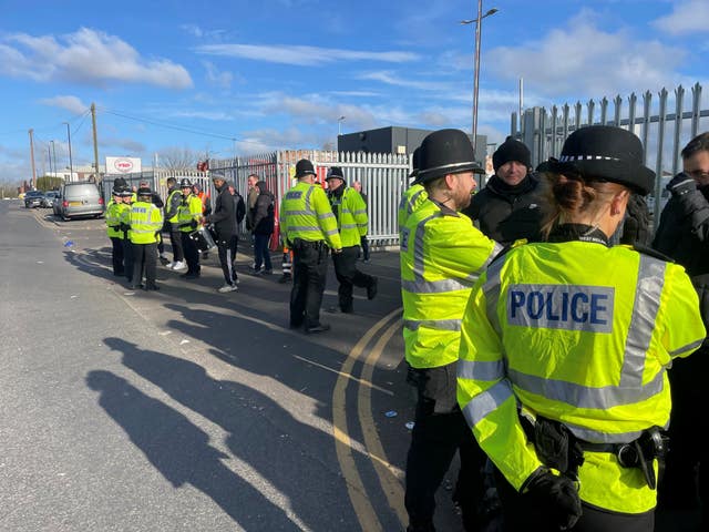 Police outside a refuse depot