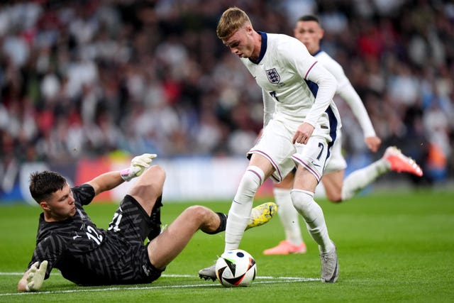 England’s Cole Palmer shoots at goal under pressure from Iceland goalkeeper Hakon Valdimarsson