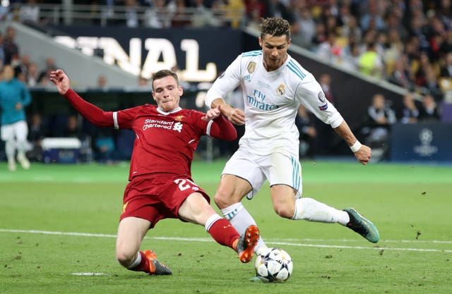 Liverpool’s Andrew Robertson, left, denies Real Madrid’s Cristiano Ronaldo