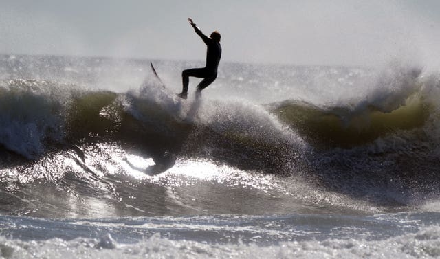 Surfers at Tynemouth Longsands beach on the North East coast