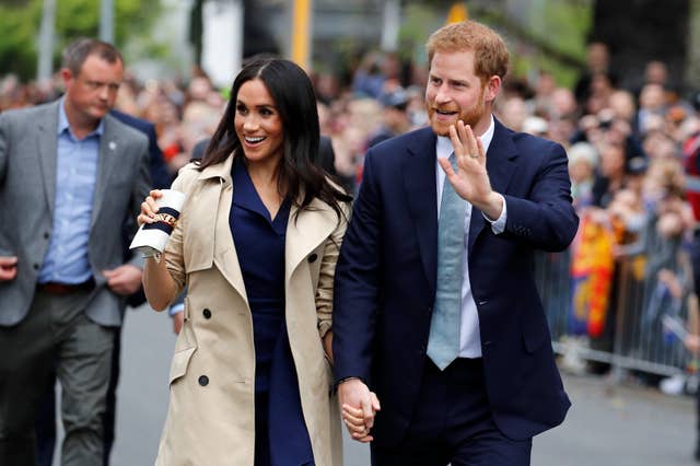 Harry and Meghan holding hands