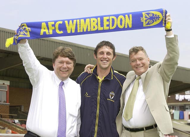 AFC Wimbledon's founding chairman Kris Stewart (left) hopes Bury supporters can continue watching their team