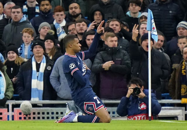 Kylian Mbappe celebrates scoring against Manchester City in the Champions League