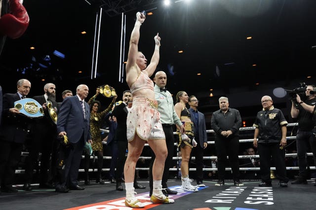 Lauren Price (left) celebrates after winning her welterweight title bout 