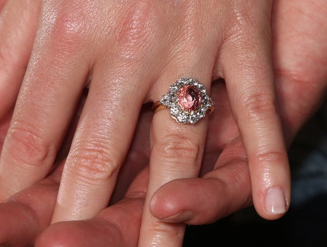 Princess Eugenie's ring contains a padparadscha sapphire surrounded by diamonds