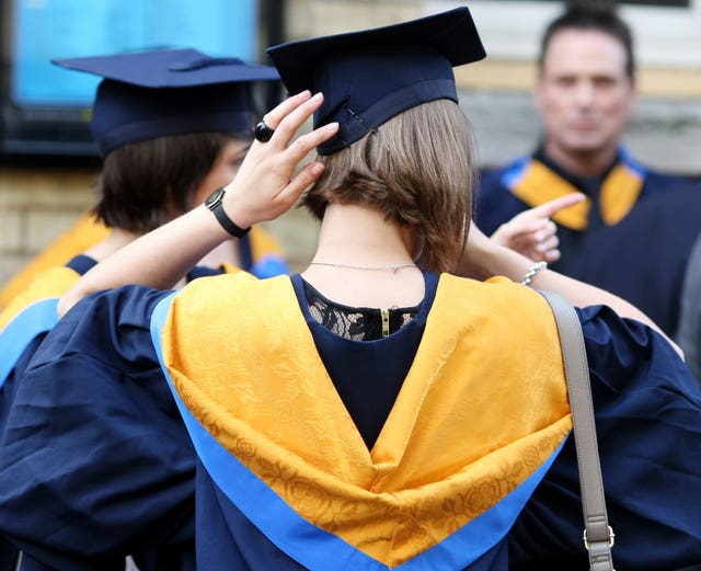 A general view of students wearing Mortar Boards and Gowns after graduating from Anglia Ruskin University in Cambridge