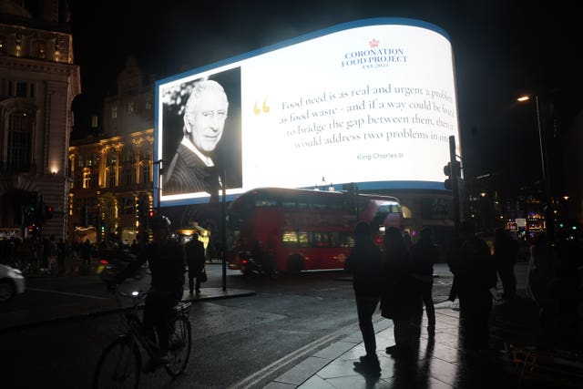 A message is displayed on the Piccadilly Lights in London, to mark the 75th birthday of the King 
