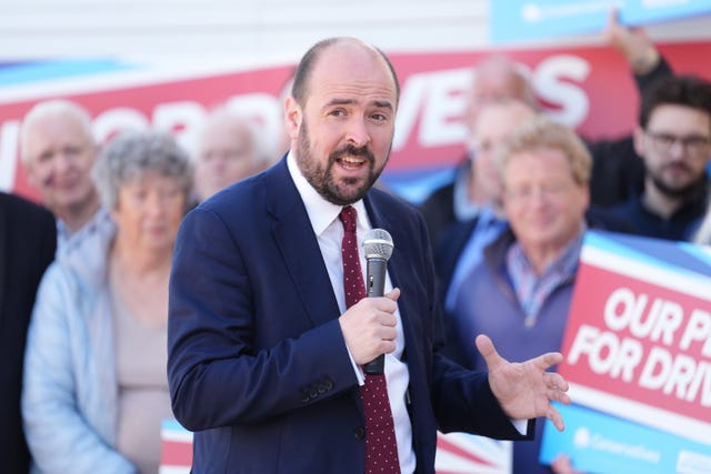 Conservative Party shadow transport secretary Richard Holden speaks at a party rally at M4 Van Sales in Swindon, Wiltshire, while on the campaign trail for the upcoming local elections