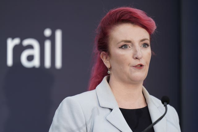 Transport Secretary Louise Haigh with a rail sign in the background