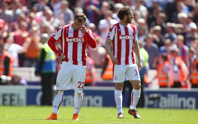 Xherdan Shaqiri (left) is left dejected at the final whistle 