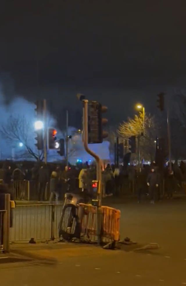 Screengrab from video taken with permission from the Twitter feed of Josh Robinson of a demonstration outside the Suites Hotel in Knowsley, Merseyside, where people are protesting against refugees 