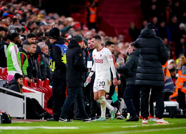 Manchester United’s Diogo Dalot leaves the pitch after being shown a red card (Peter Byrne/PA)