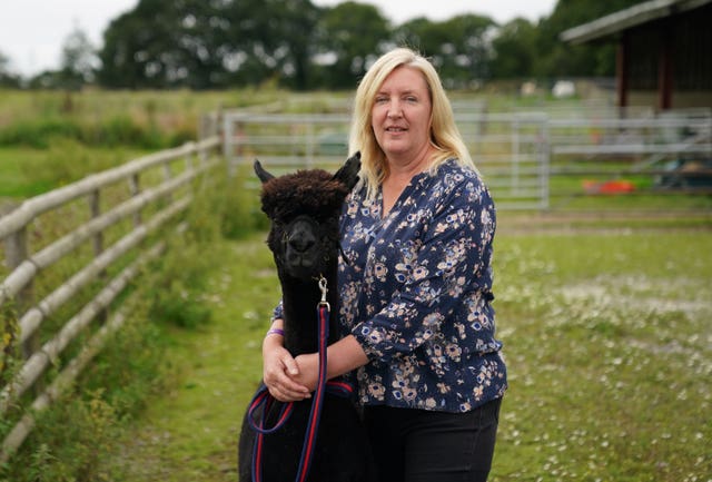 Geronimo the alpaca previously pictured with owner Helen Macdonald (Andrew Matthews/PA)