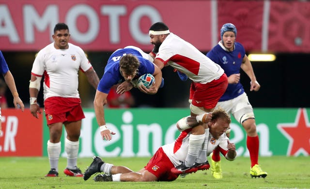 France's Damian Penaud is tackled by Tonga's Maama Vaipulu