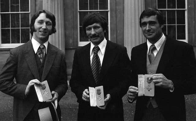alongside Tommy Smith, the former Liverpool footballer and tennis star Roger Taylor at Buckingham Palace after receiving their MBEs 