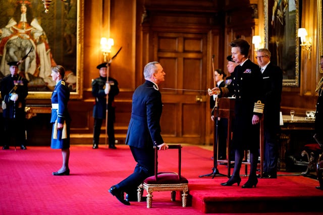 Sir Iain Livingstone being knighted