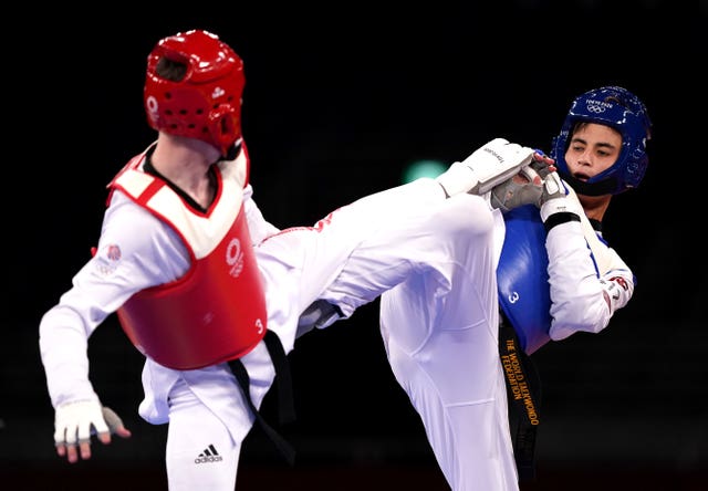 Great Britain’s Bradly Sinden (left) in action against Uzbekistan’s Ulugbek Rashitov in the Men’s 68kg gold medal contest