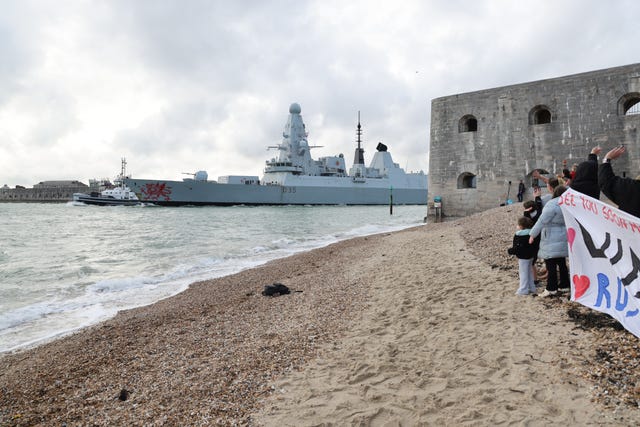 HMS Dragon leaving Portsmouth Harbour on its way to the eastern Mediterranean to bolster British defences in the region