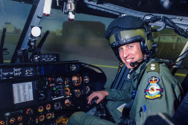Photo from 2008 of the Prince of Wales on the flight deck of a helicopter during a visit to the Army Air Corps