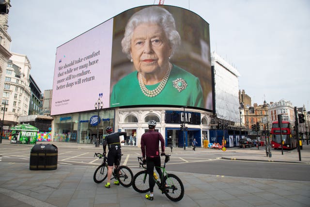 An image of the Queen and quotes from her broadcast to the UK and the Commonwealth in relation to the coronavirus epidemic displayed at London’s Piccadilly Circus in April