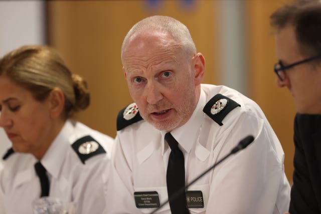 Police Service of Northern Ireland Assistant Chief Constable Davy Beck (centre) speaks during the monthly meeting of the board
