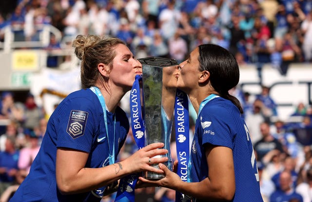 Chelsea's Sam Kerr and Millie Bright kiss the Women's Super League trophy