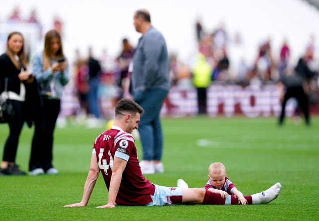 Declan Rice and his son on the pitch at full-time 