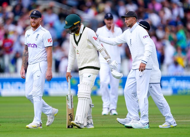 Australia’s Nathan Lyon is patted on the back by England’s Joe Root