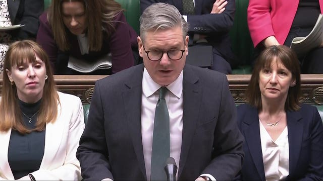 Sir Keir Starmer speaking during Prime Minister’s Questions with Angela Rayner to his right and Rachel Reeves to his left