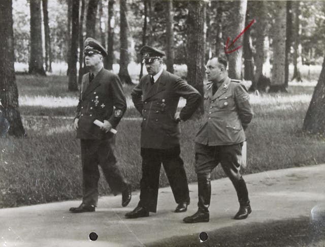 Adolf Hitler flanked by Joachim von Ribbentrop and Martin Bormann (National Archives/PA)