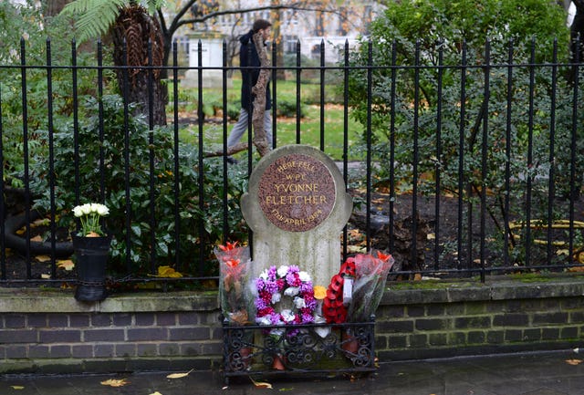 Flowers are left at the Yvonne Fletcher memorial (Stefan Rousseau/PA)