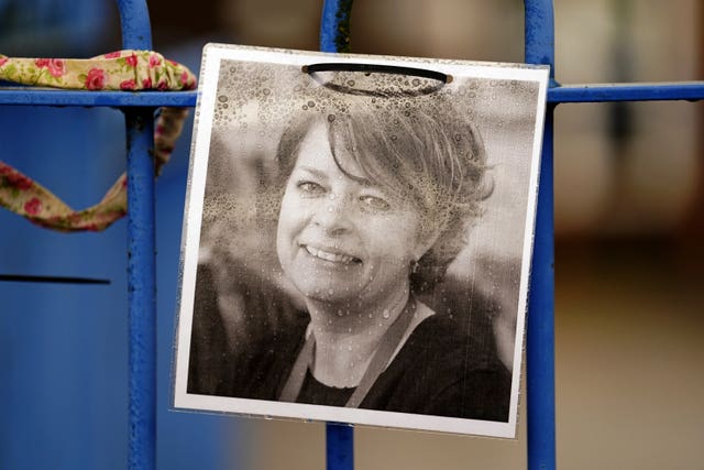 A photograph of Ruth Perry attached to the fence outside John Rankin Schools in Newbury, Berkshire