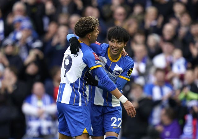 Kaoru Mitoma (right) celebrates scoring the fifth goal