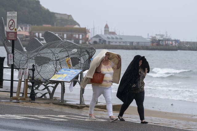 People walk along the seafront in Scarborough, North Yorkshire